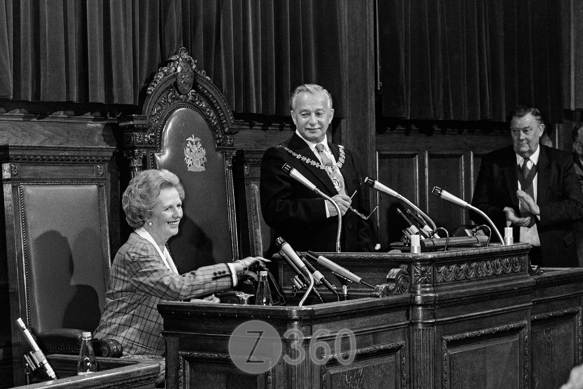 Margaret Thatcher holds onto her handbag